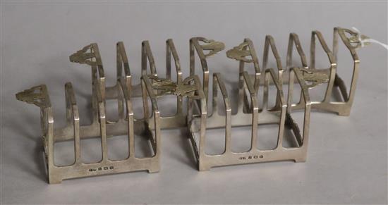 A set of four Art Deco silver five bar toast racks, Deakin & Francis Ltd, Birmingham, 1936, width 98mm.